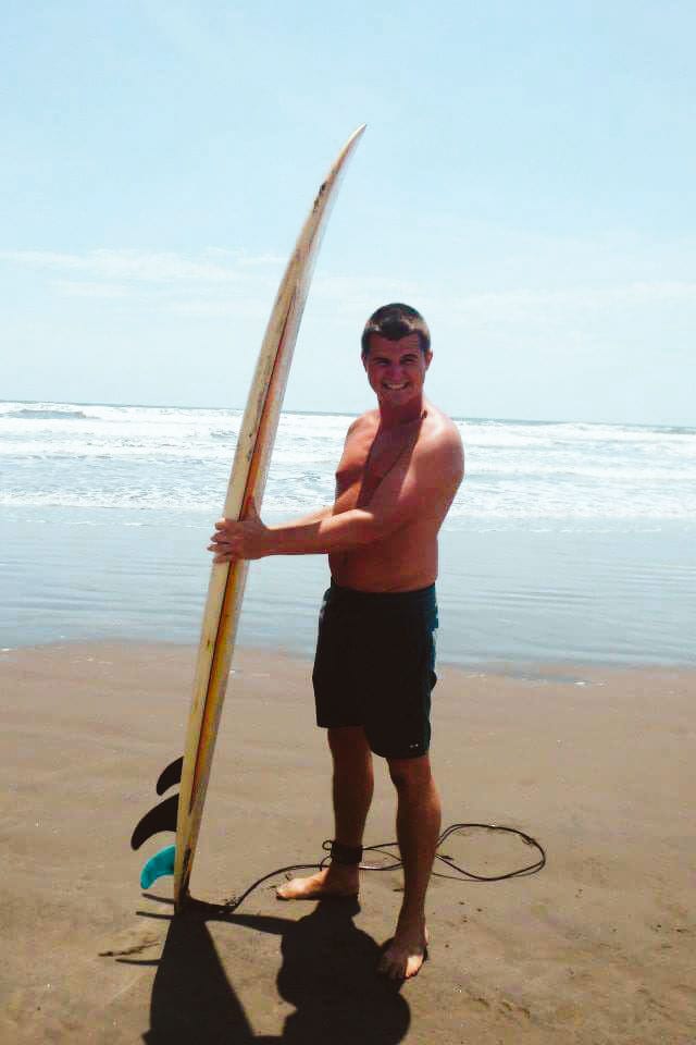 Happy with his surfboard in El Cuco