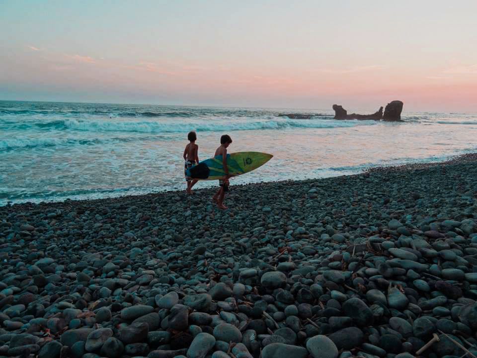 Kids enjoying a sunset surf in El Tunco