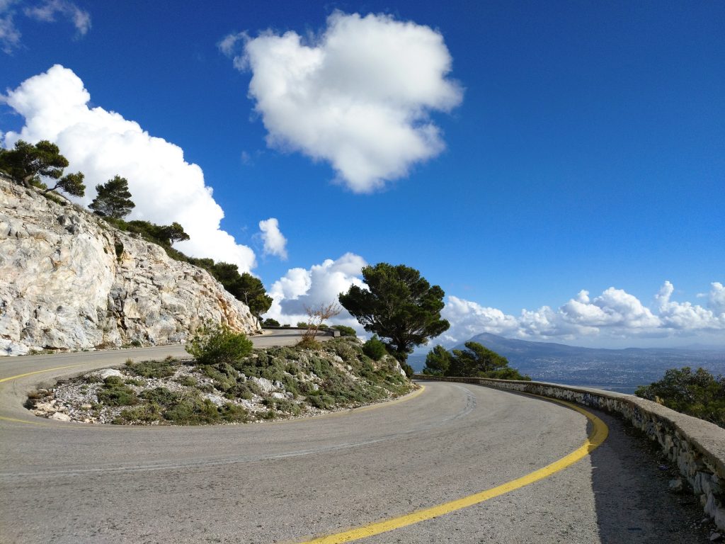a scenic winding mountain road in Mount Parnitha Greece